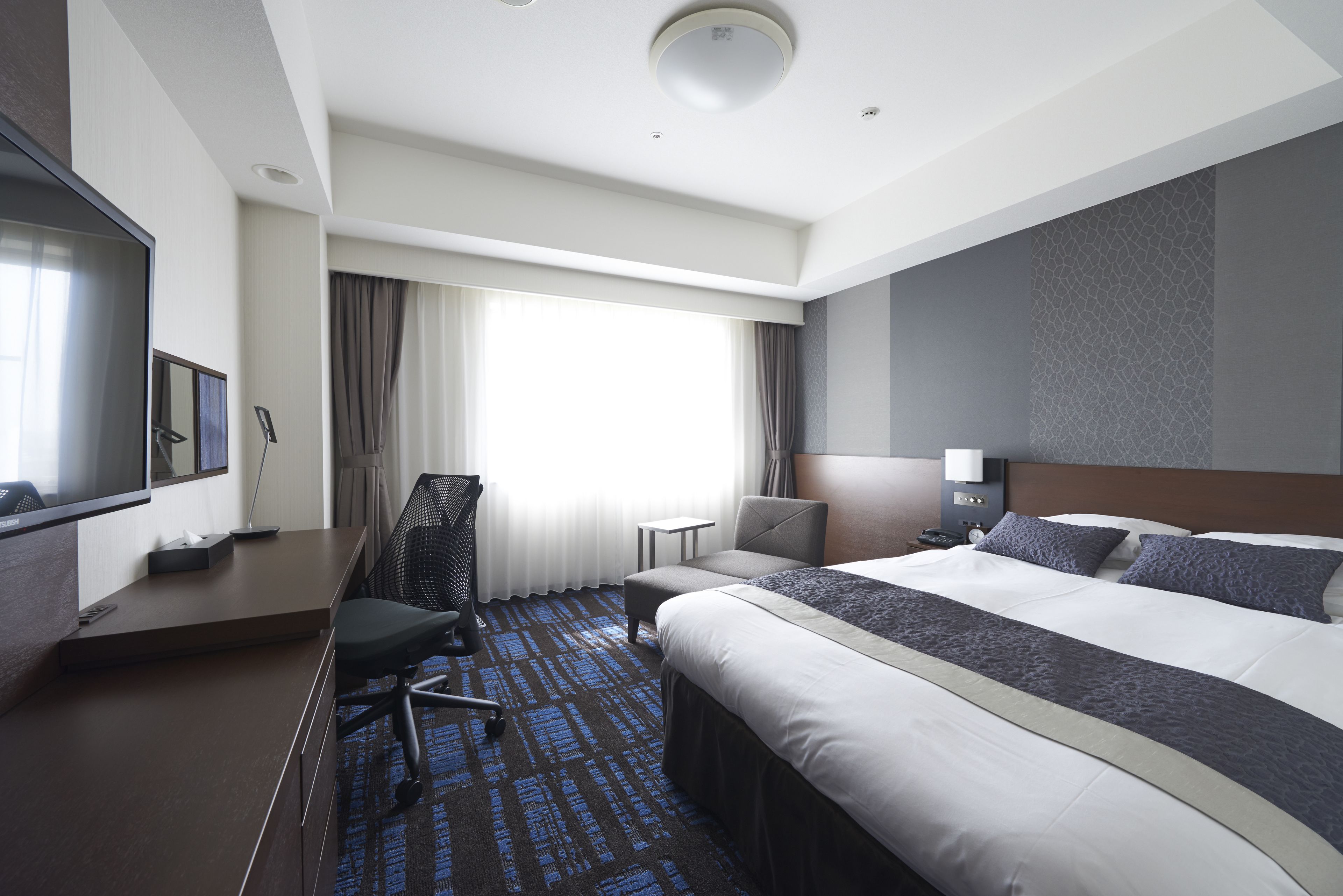 premium bedding, desk, blackout curtains, soundproofing