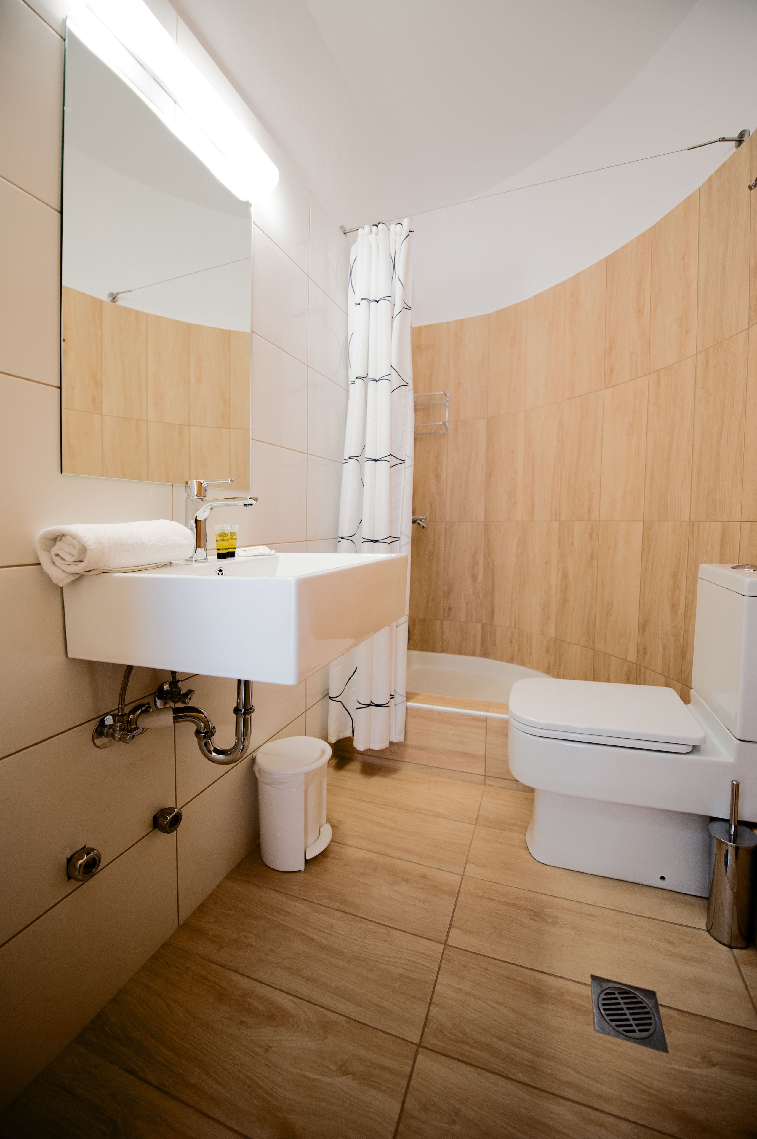 eco-friendly toiletries, bathrobes, slippers, towels