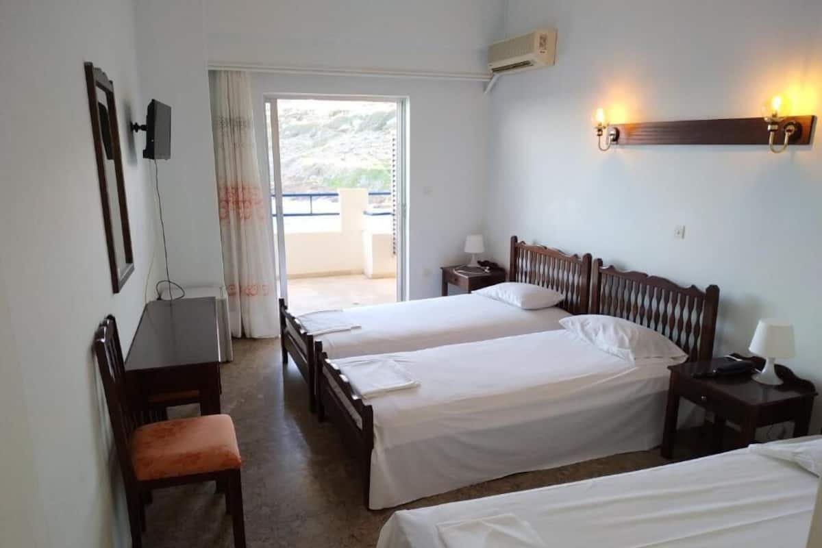 Triple Room, Sea View | Iron/ironing board, bed sheets