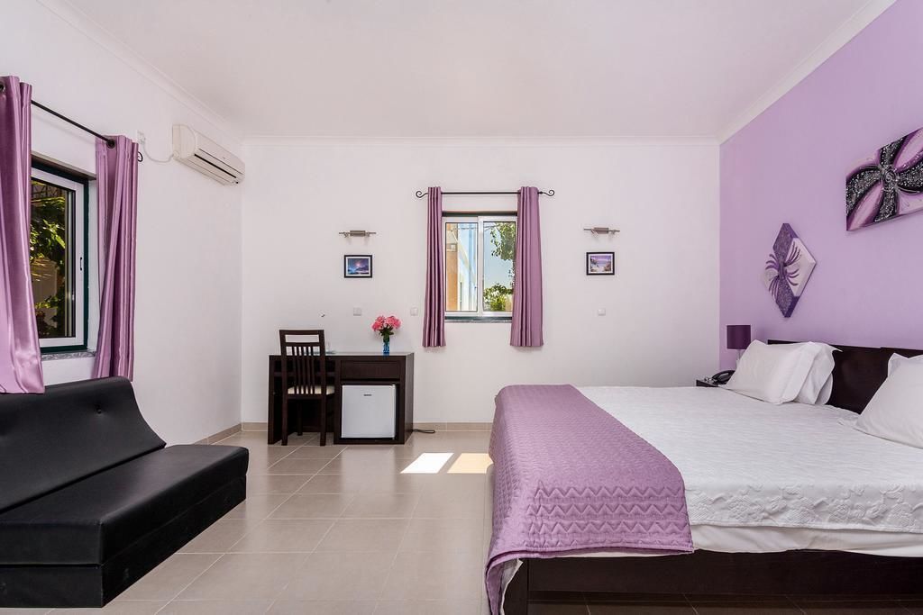 suite | desk, blackout curtains, soundproofing, rollaway beds