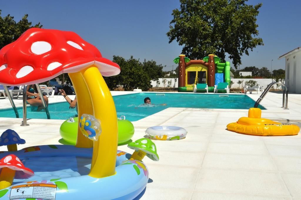 seasonal outdoor pool, open 8:00 am to 8:00 pm, pool umbrellas