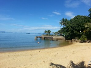 On the beach, sun loungers, beach umbrellas, beach towels