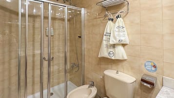 Bathtub, hair dryer, towels, soap