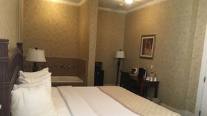 Suite, 1 King Bed, Jetted Tub | Iron/ironing board, WiFi (free), bed sheets - The Island House Hotel (Port Clinton)