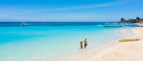 On the beach, white sand, free beach cabanas, sun loungers