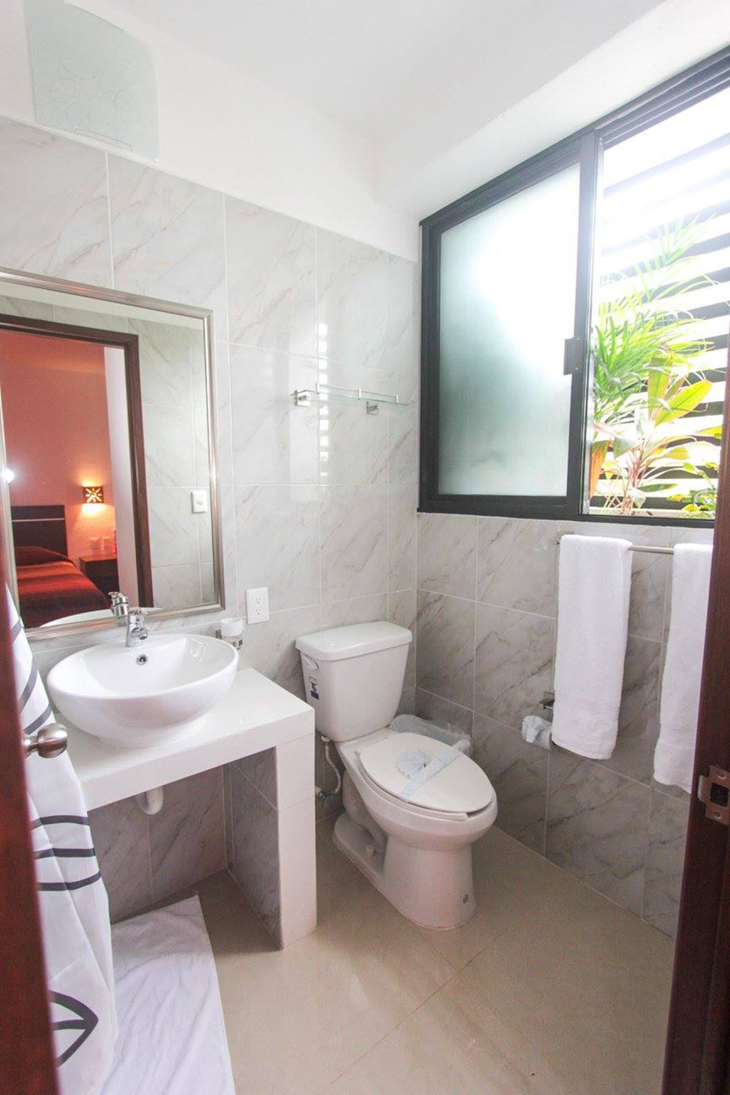 deluxe suite, 1 queen bed | bathroom | shower, hair dryer, towels