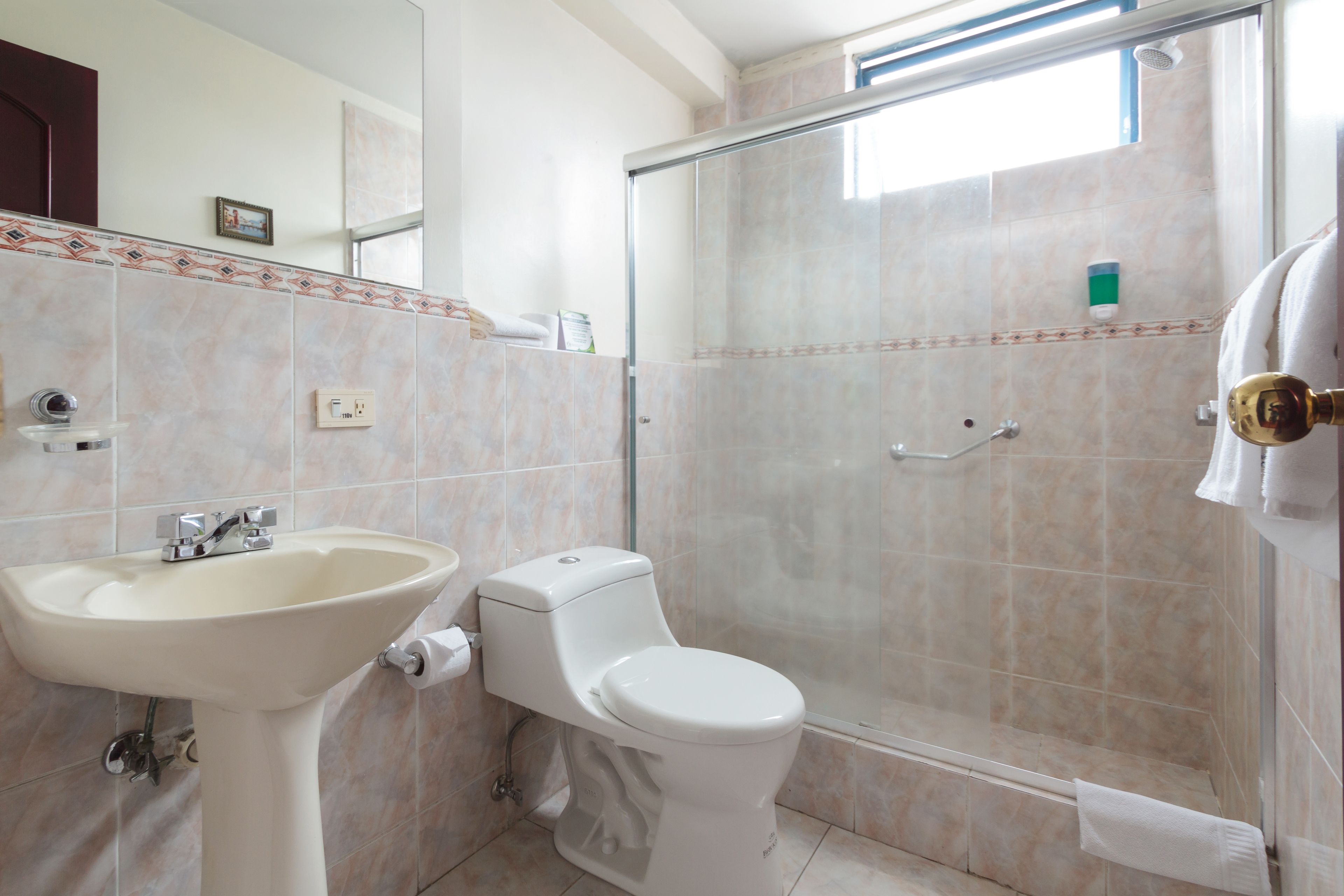 standard double room | bathroom | shower, free toiletries, hair dryer, towels