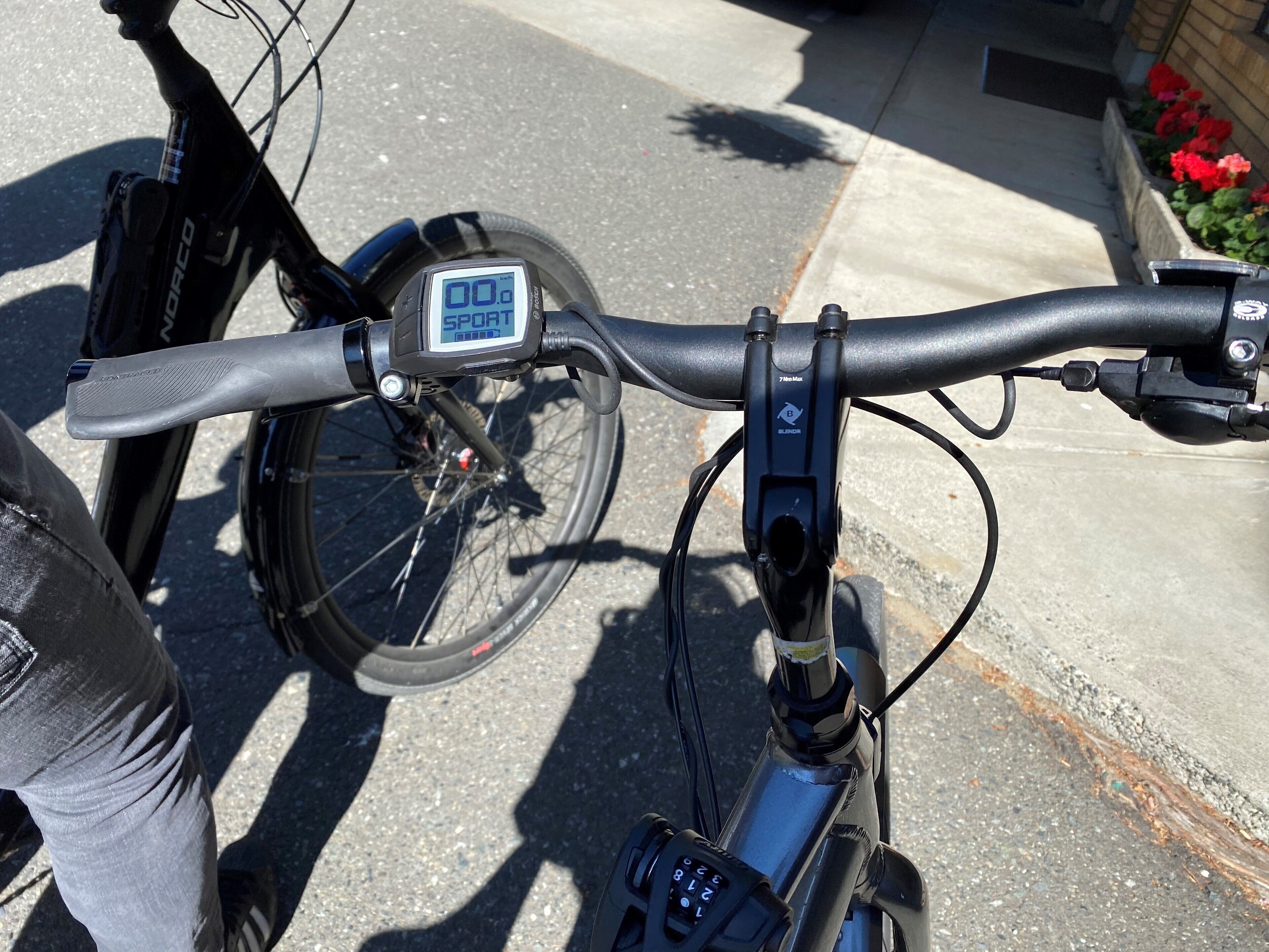 A bicycle with a digital display and a lock mechanism.