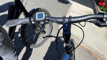 A bicycle with a digital display and a lock mechanism.