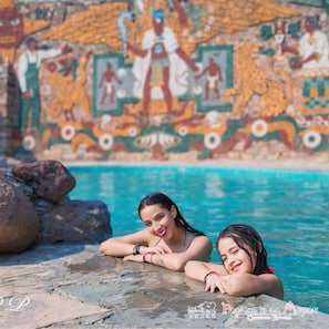 2 outdoor pools, open 9 AM to 7 PM, pool umbrellas, pool loungers