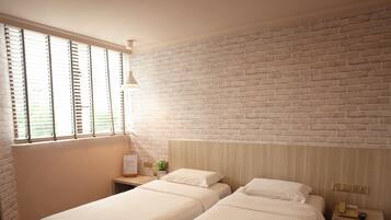 Habitación Deluxe con 2 camas individuales | Caja de seguridad en la habitación, wifi gratis y ropa de cama