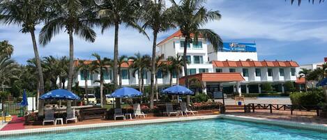 Outdoor pool, open 7:30 AM to 5:00 PM, pool loungers