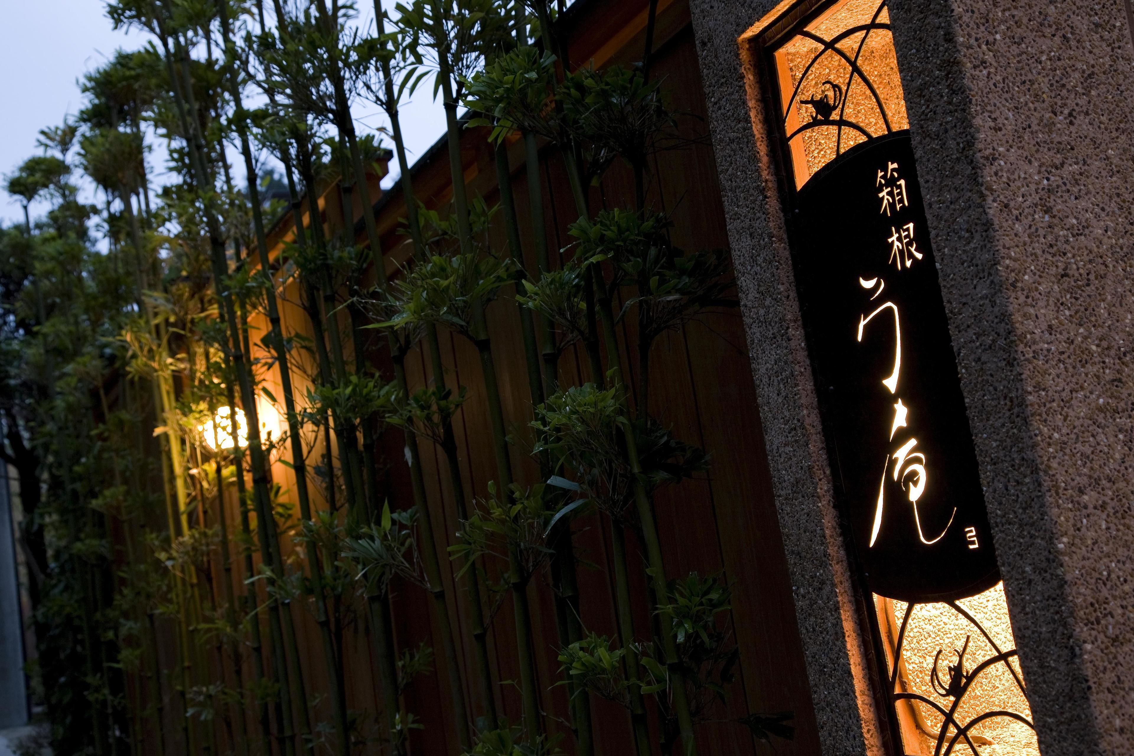 A traditional building with a sign featuring Japanese characters.