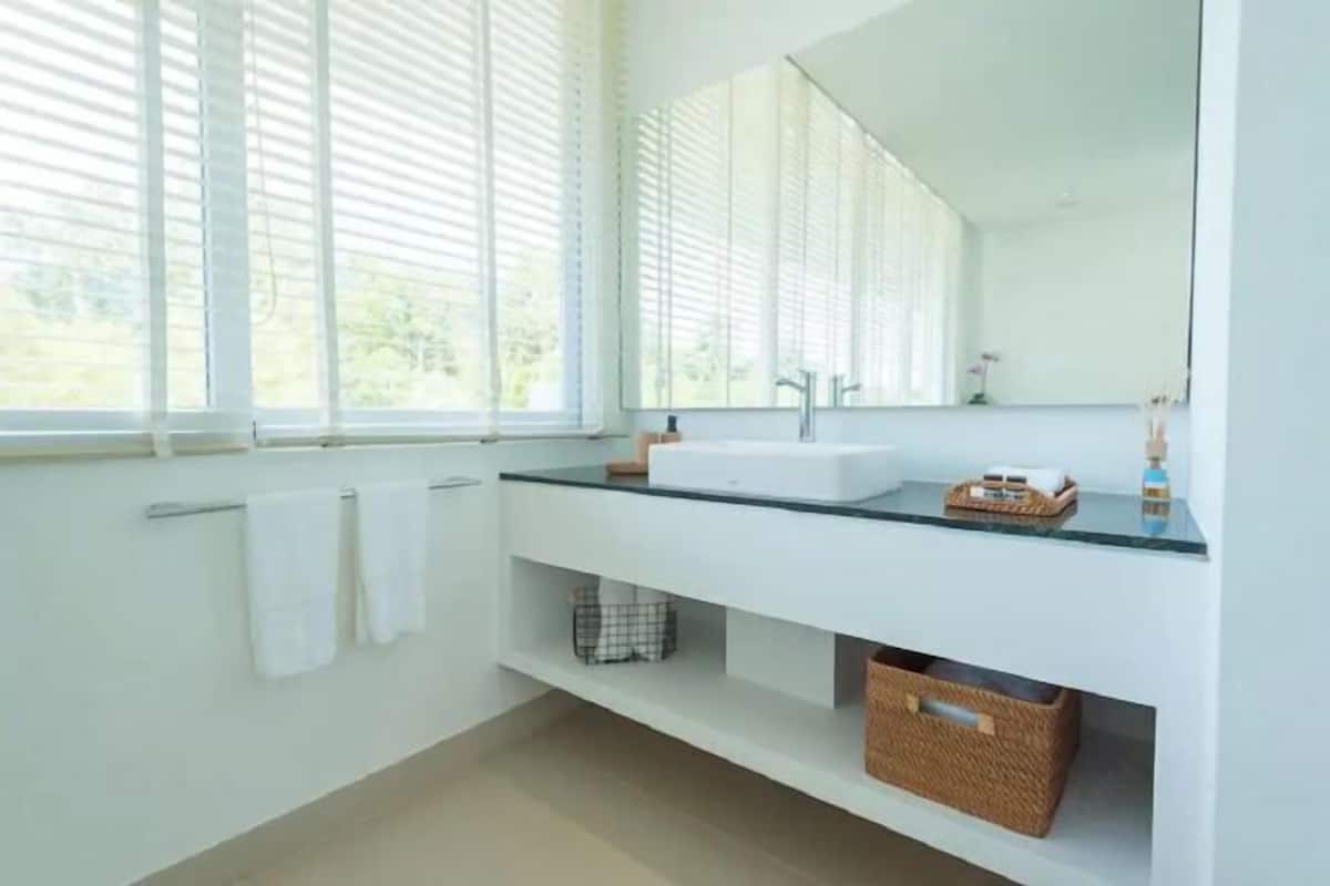 Bathroom | Shower, designer toiletries, hair dryer, bathrobes
