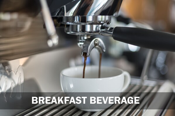 A coffee machine dispensing coffee into a cup. - Cove 55 (Kuching)