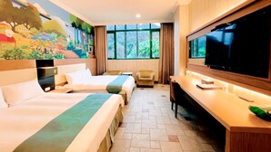 A hotel room with two beds, a desk, a TV, and a mural on the wall. - Uni-Resort Mawutu (Guanxi)