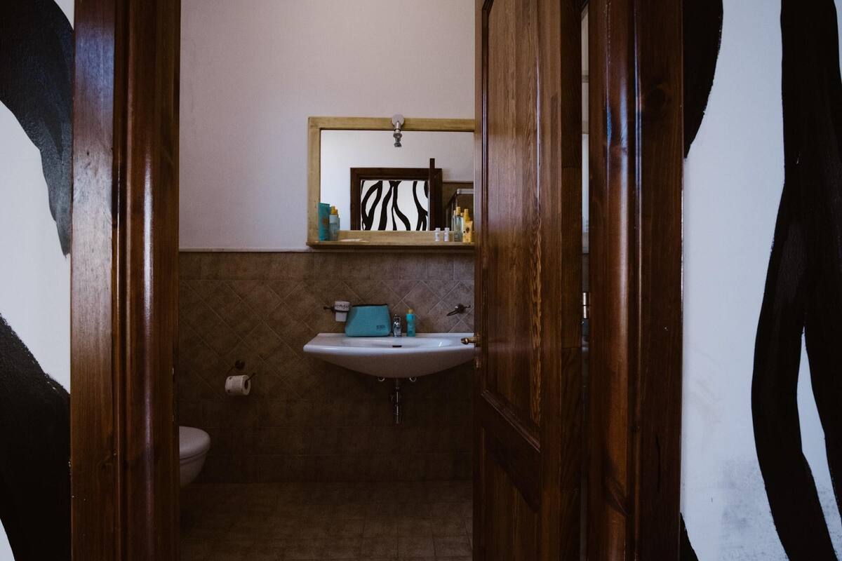 signature double room, 1 queen bed, patio (mono 2 adults) | bathroom | shower, rainfall showerhead, hair dryer, bidet