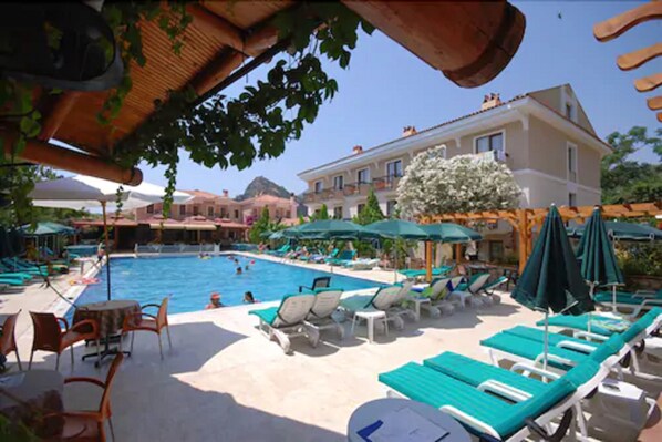 Indoor pool, outdoor pool, pool umbrellas, pool loungers