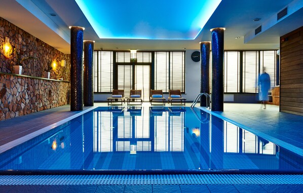 Indoor pool, open 10 AM to 9 PM, pool loungers