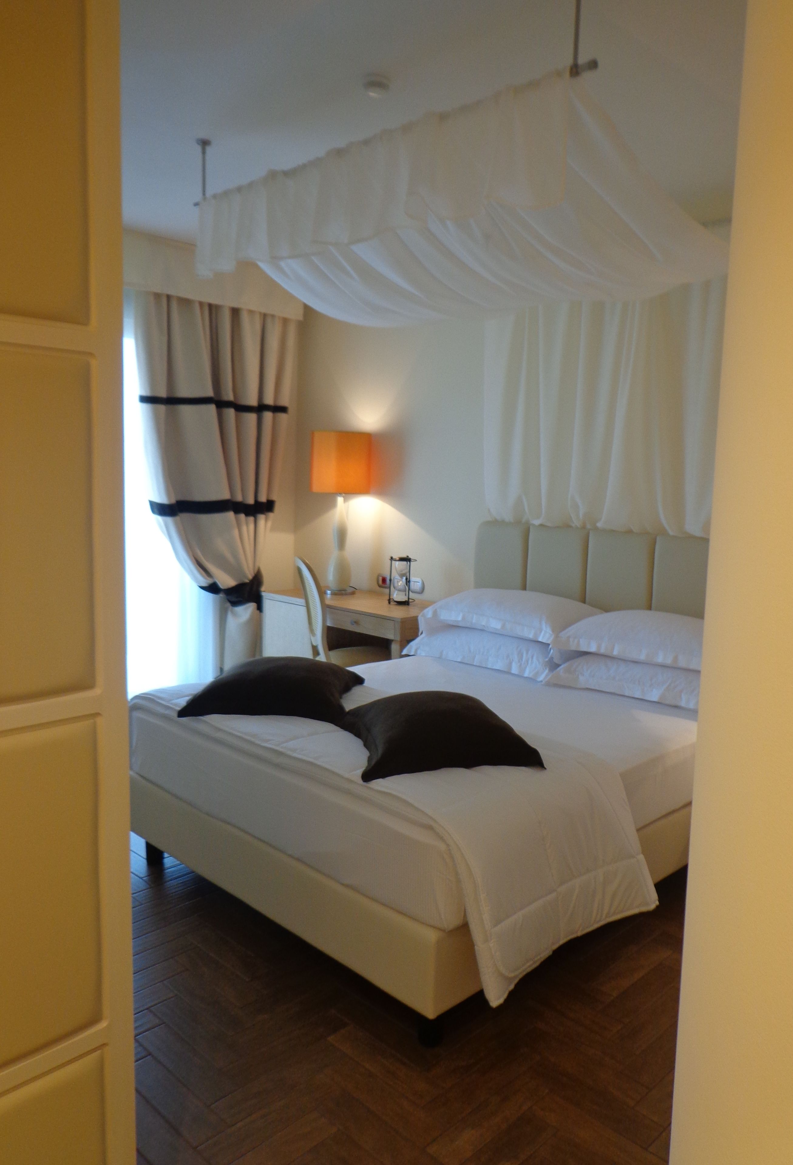 premium bedding, down duvets, minibar, in-room safe