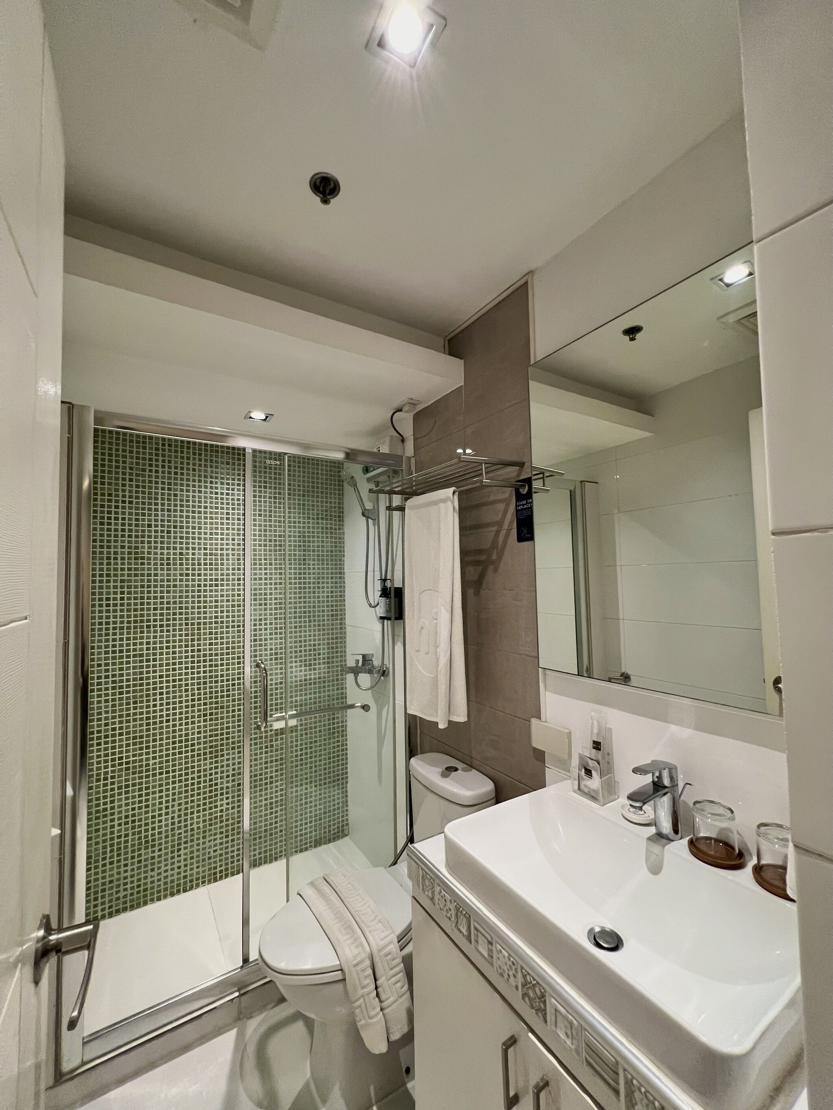 two bedroom suite | bathroom | shower, free toiletries, hair dryer, slippers