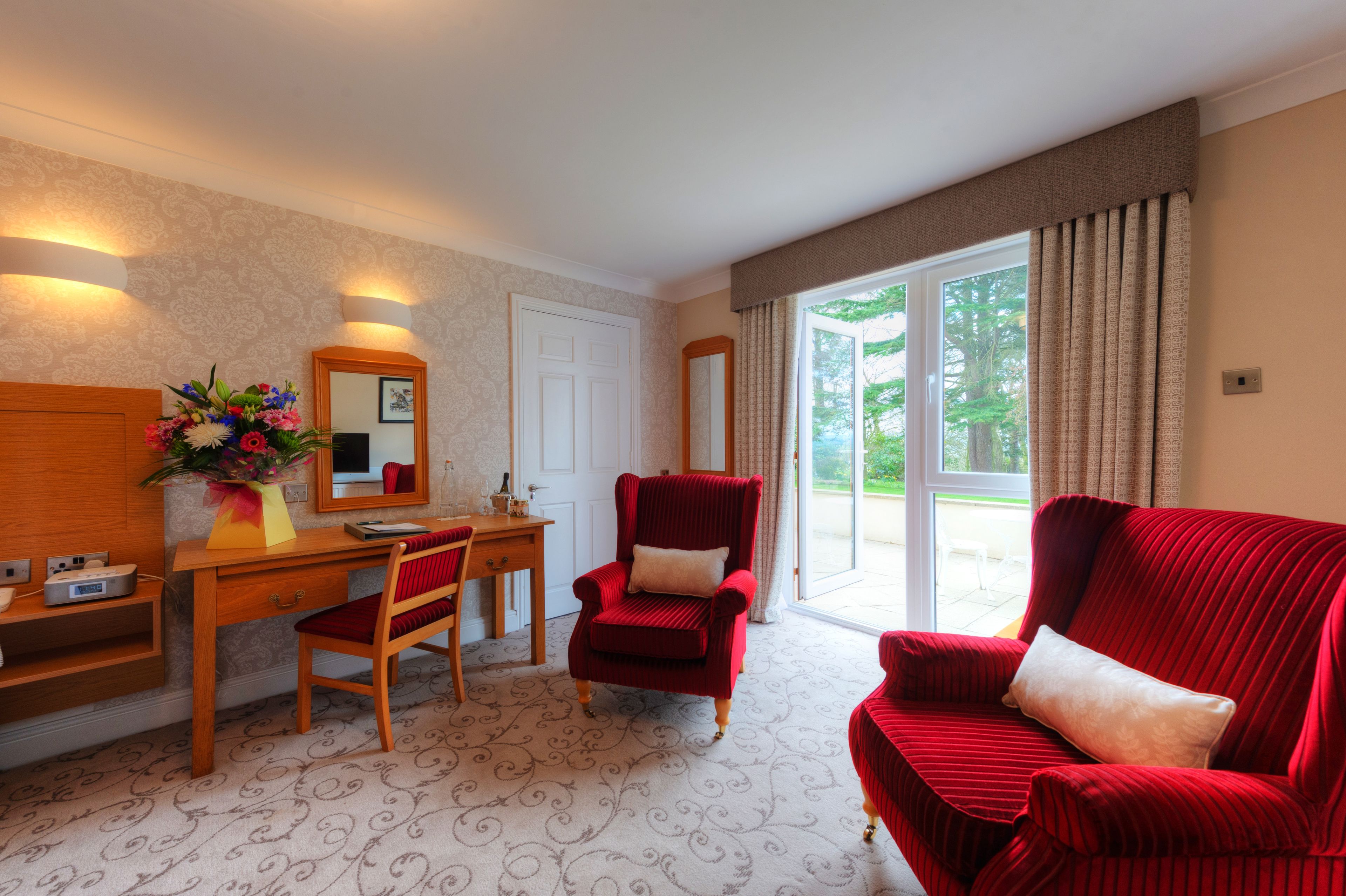 twin room, garden view | in-room safe, individually decorated, desk, iron/ironing board