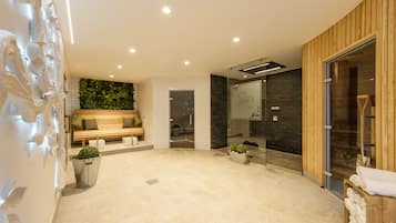 Welcome to our lobby, featuring a reception desk, comfortable seating area, and digital display.