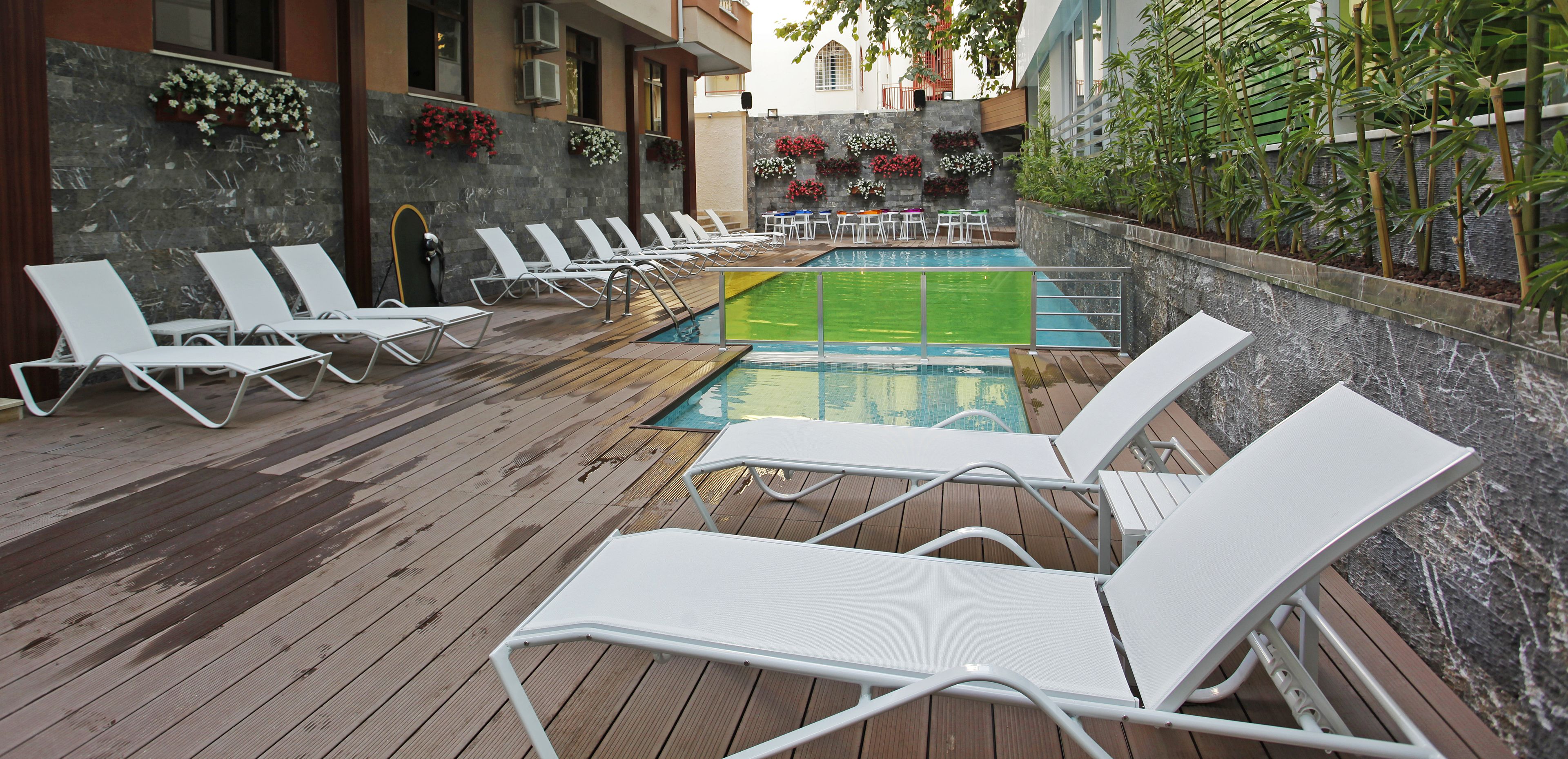 seasonal outdoor pool, pool umbrellas, pool loungers
