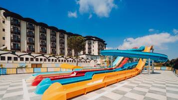 A water park with multiple slides and a checkered floor.