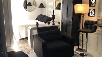 Premium Studio Suite, Multiple Beds | Living area | 36-inch Smart TV with cable channels, Netflix, Hulu