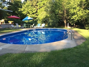 Seasonal outdoor pool, open 8:00 AM to 9:00 PM, pool umbrellas