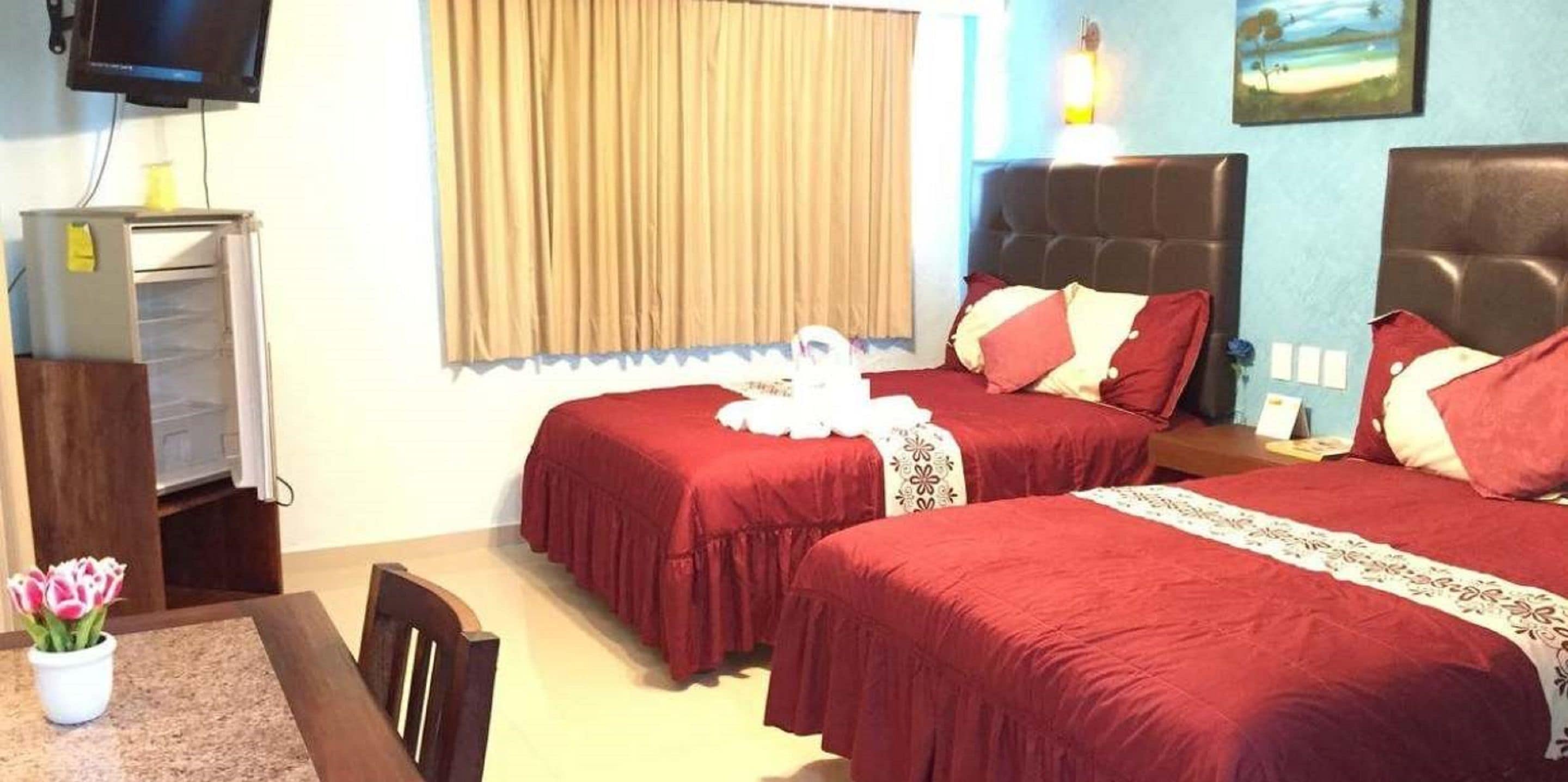 premium double room, 2 queen beds, balcony, city view | minibar, in-room safe, desk