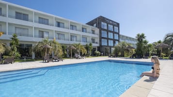Indoor pool, outdoor pool, pool umbrellas, pool loungers