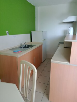 Apartment, 2 Bedrooms | Private kitchen | Fridge, microwave, coffee/tea maker, electric kettle