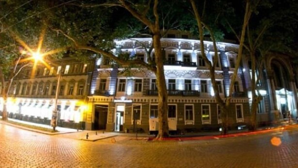 A historic building with classical architecture, featuring multiple stories and a central courtyard. - Metro Hotel Apartments (Odesa)
