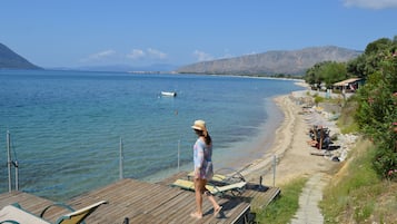 On the beach, sun loungers, beach umbrellas, beach towels