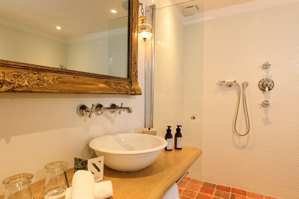 executive suite | bathroom | designer toiletries, hair dryer, bathrobes, slippers