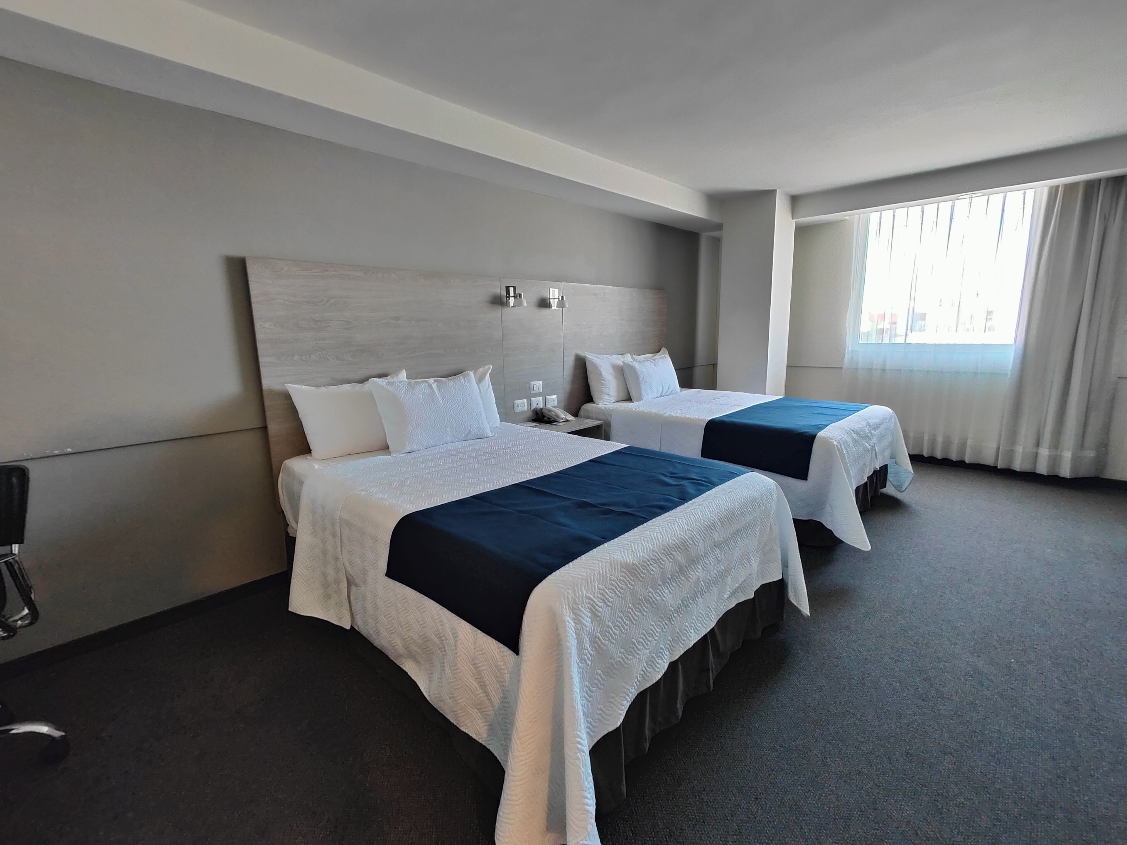 deluxe room, 1 bedroom | in-room safe, blackout curtains, soundproofing, iron/ironing board