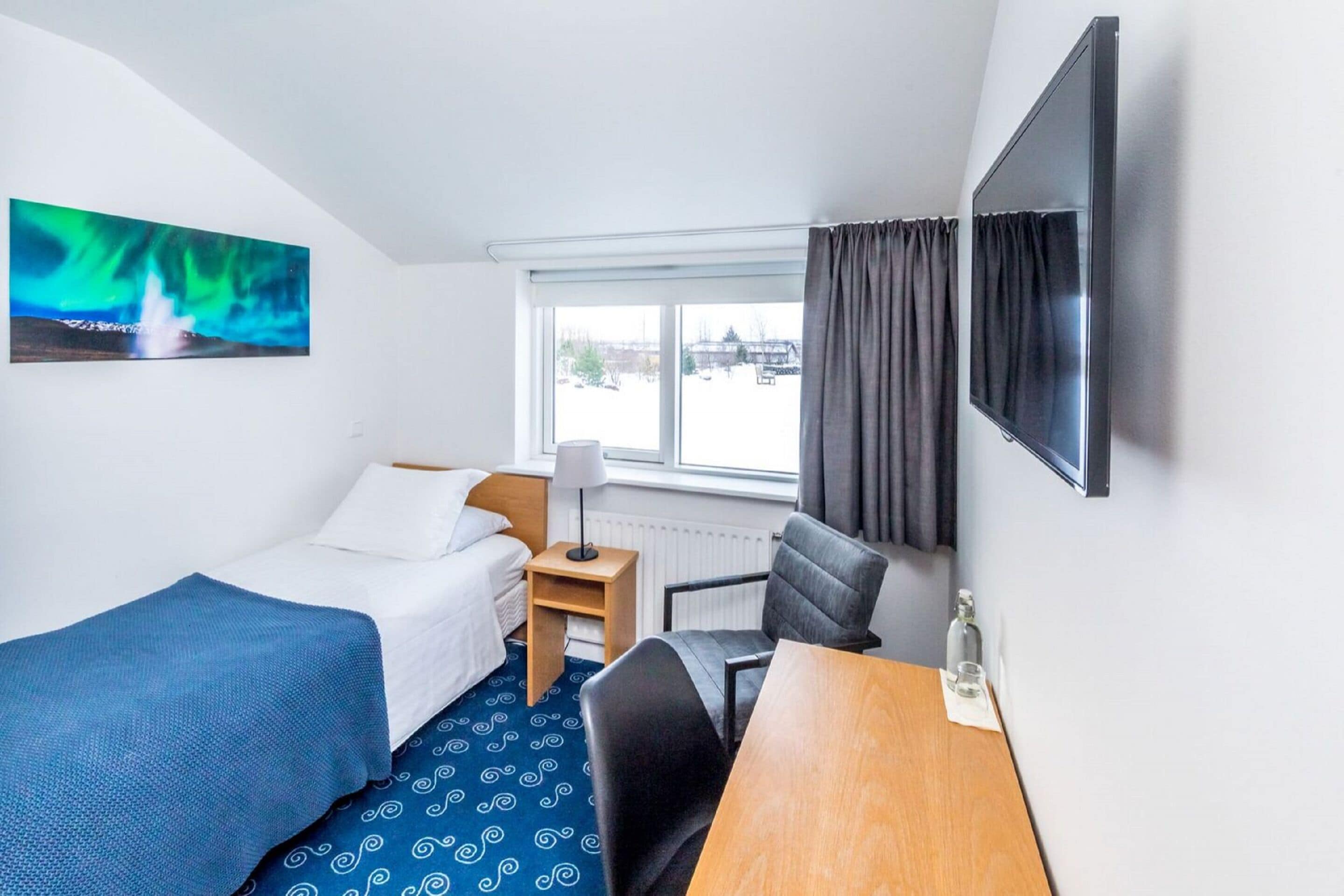 single room | hypo-allergenic bedding, desk, blackout curtains, rollaway beds