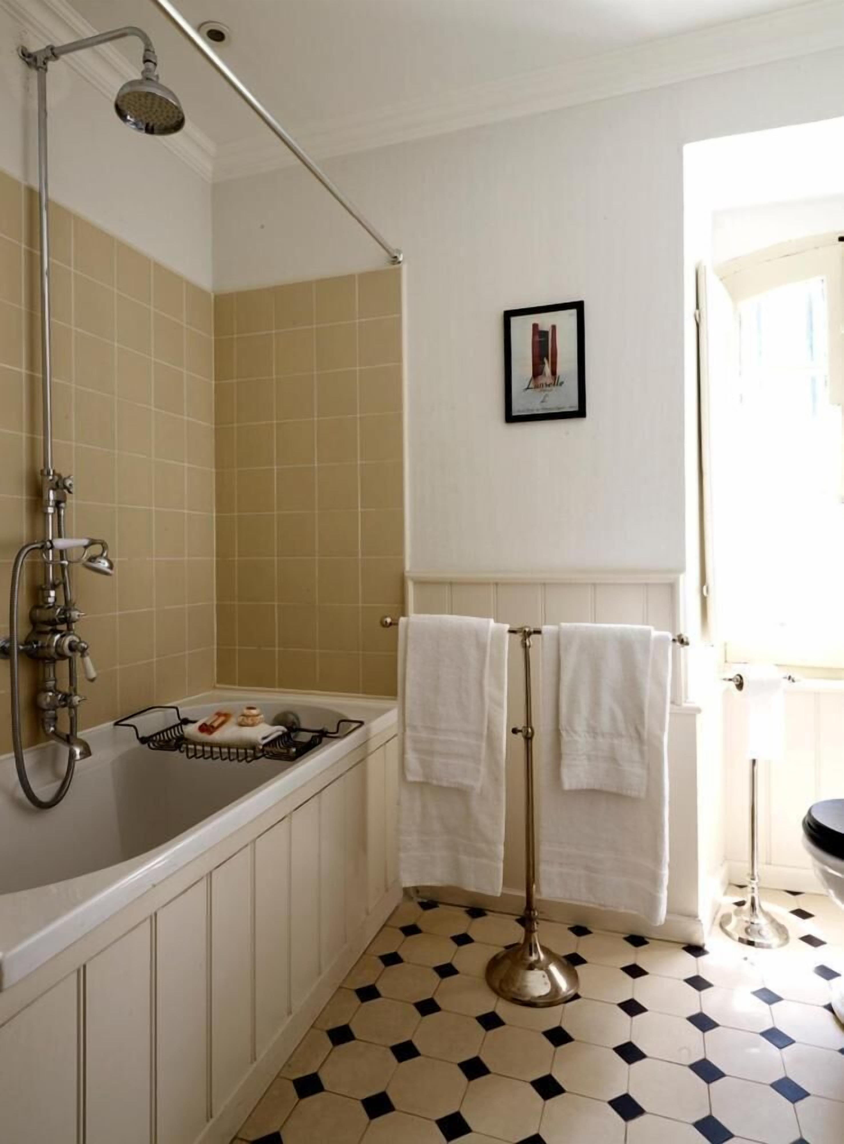 deep-soaking bathtub, rainfall showerhead, free toiletries, hair dryer