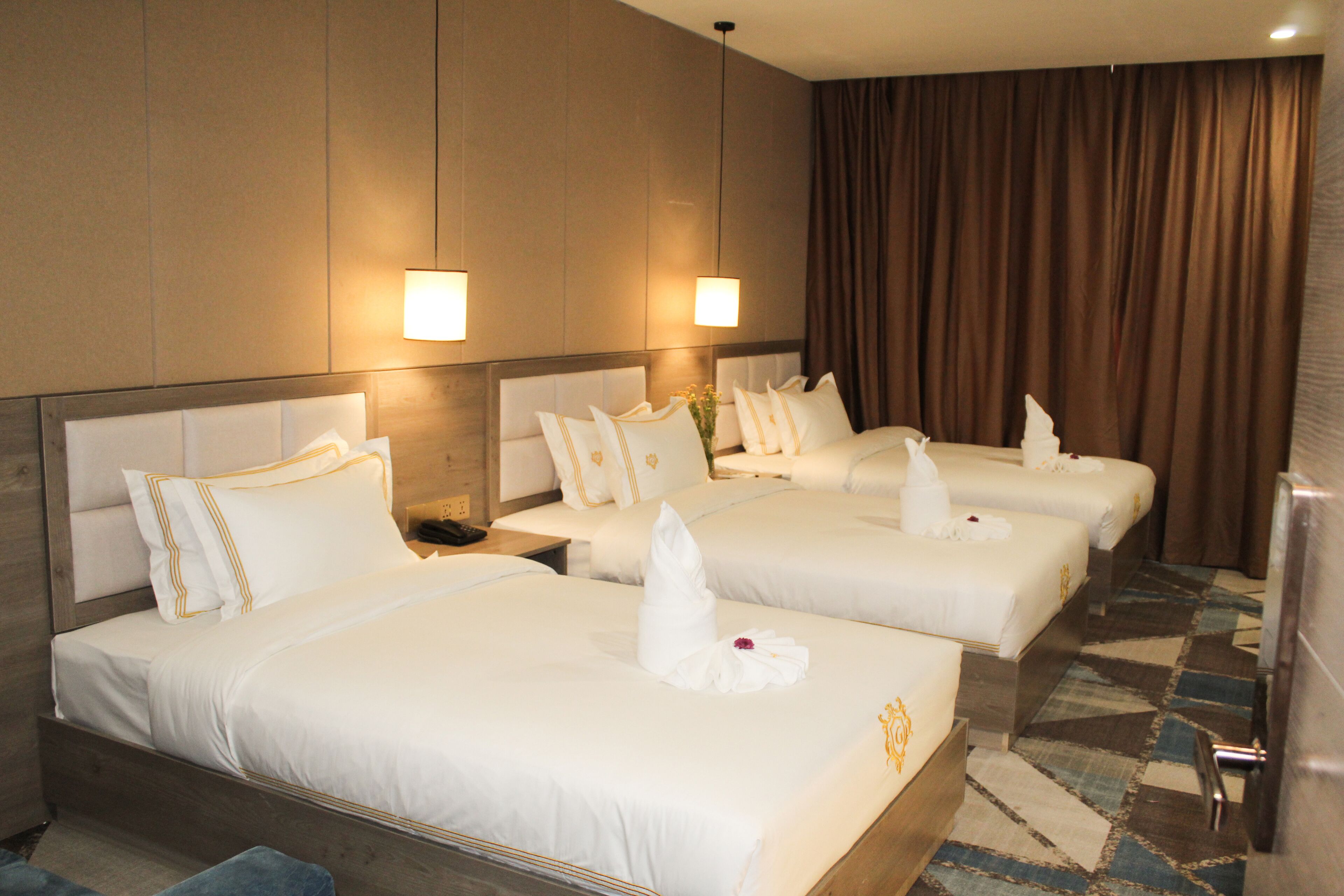 deluxe triple room | minibar, in-room safe, desk, blackout curtains