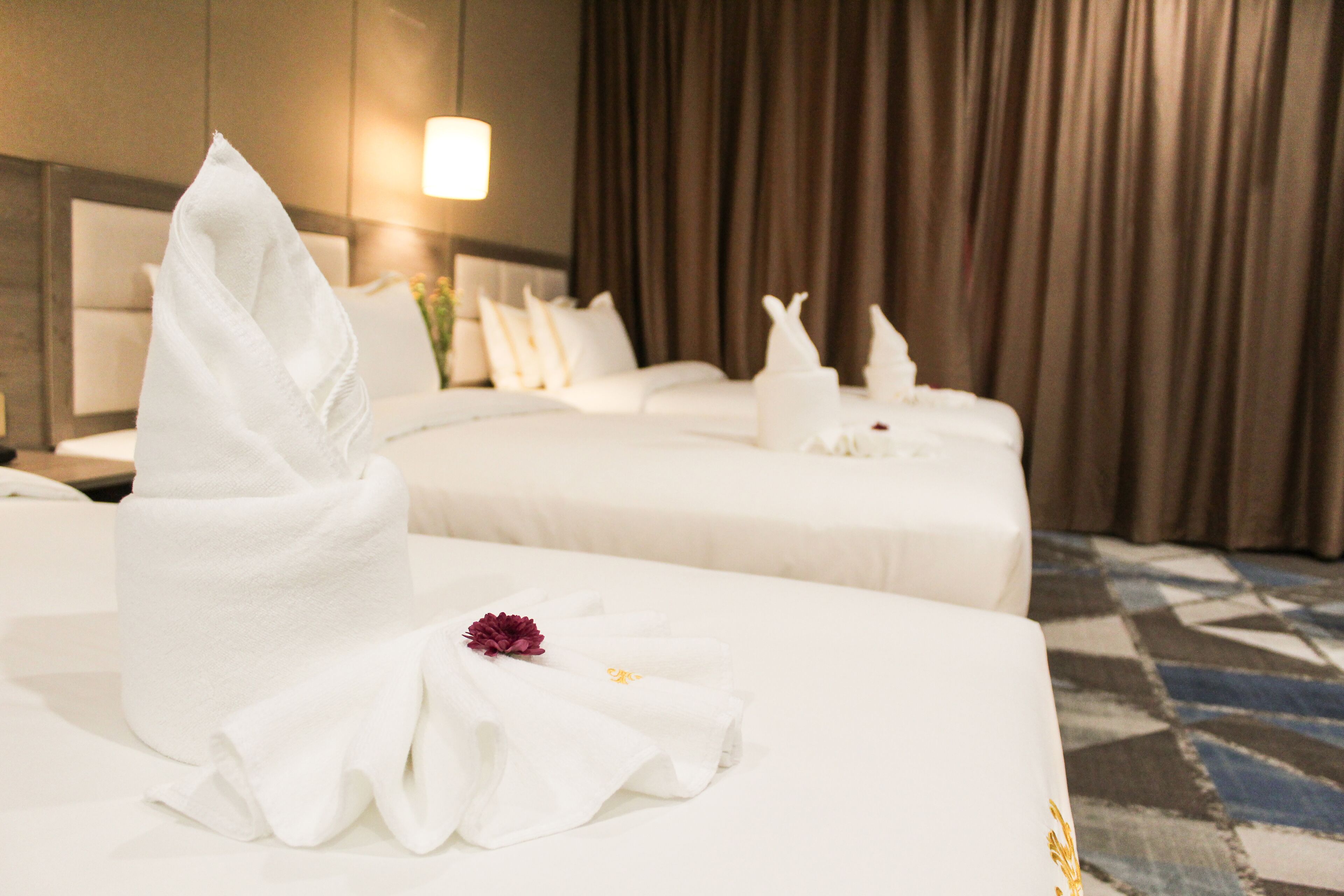 deluxe triple room | minibar, in-room safe, desk, blackout curtains