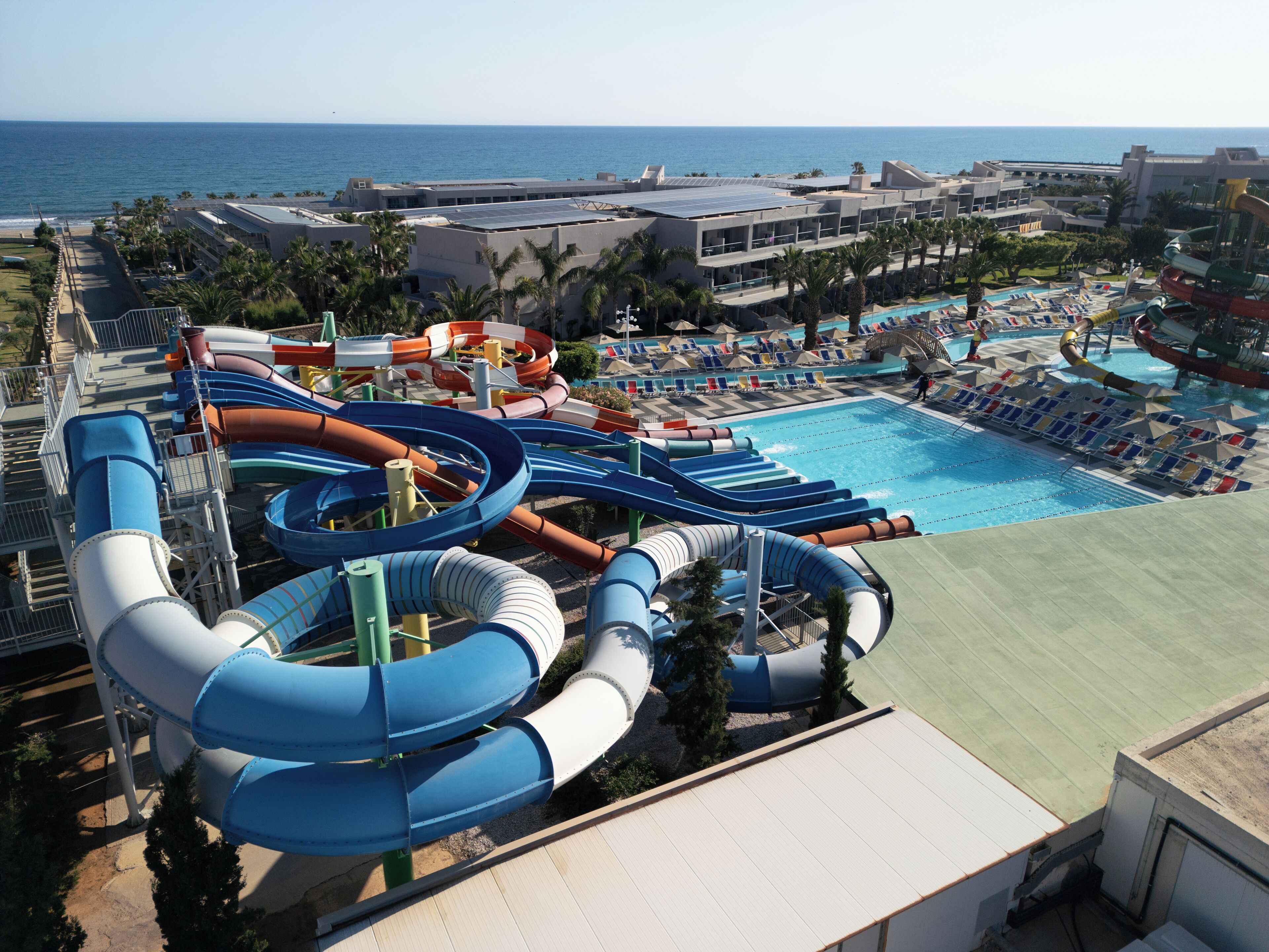 A water park with multiple slides and a pool area.