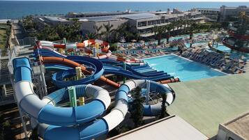 A water park with multiple slides and a pool area.