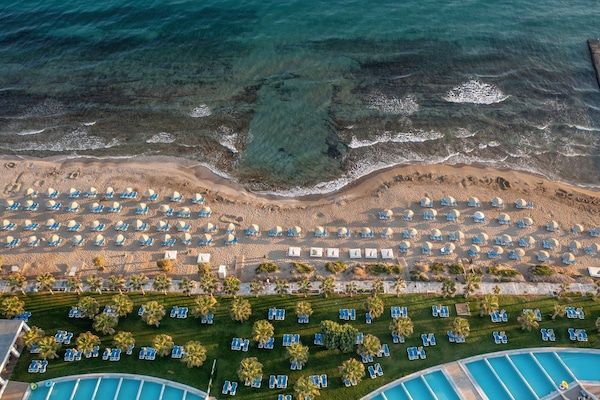 On the beach, sun loungers, beach umbrellas, beach towels