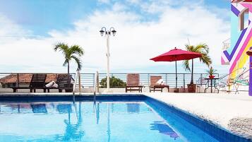 Outdoor pool, open 9 AM to 8:00 PM, sun loungers