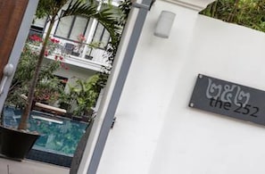 A sign with the text "the 252" on a white wall, indicating a property or location. - The 252 (Phnom Penh)