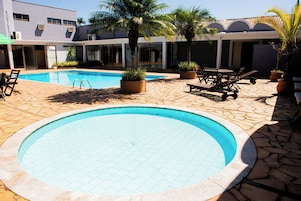 Outdoor pool, pool umbrellas, sun loungers