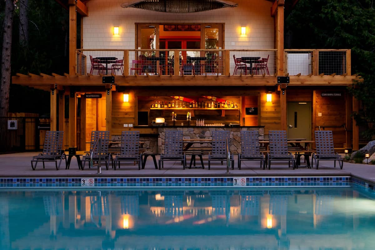 outdoor pool, open 10 am to 10 pm, pool umbrellas, pool loungers