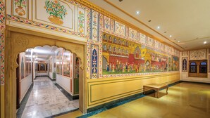 A grand hallway with ornate murals and a marble floor. - Rang Mahal Jaisalmer (Jaisalmer)